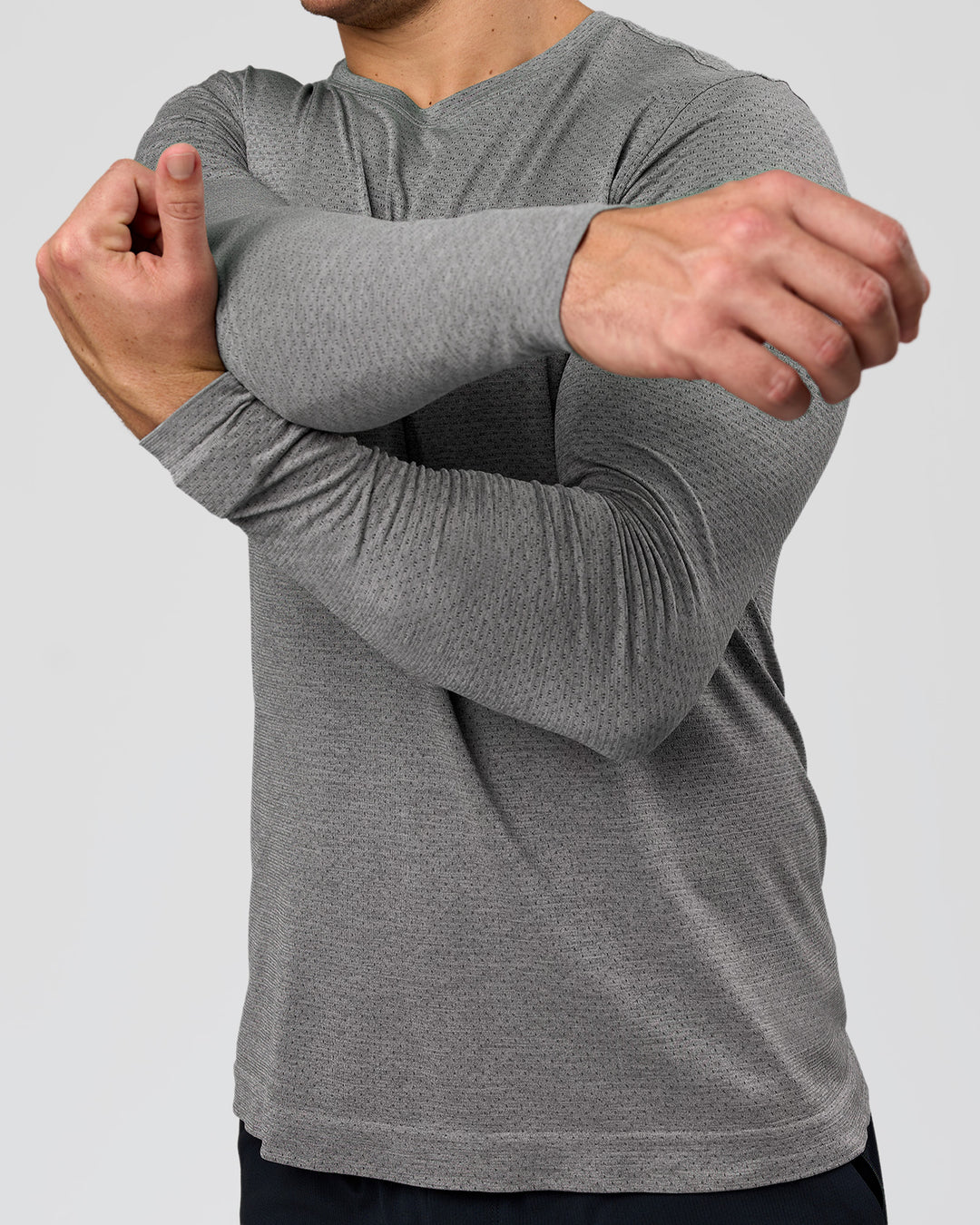 Man wearing AeroFLX+ Seamless Long Sleeve Tee (Set in Sleeve) - Dark Storm/Alloy | Model:Jaiden | Size:L - view 7