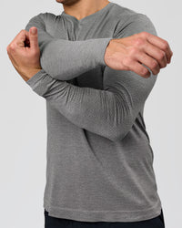 Man wearing AeroFLX+ Seamless Long Sleeve Tee (Set in Sleeve) - Dark Storm/Alloy | Model:Jaiden | Size:L | Thumbnail Index: 6