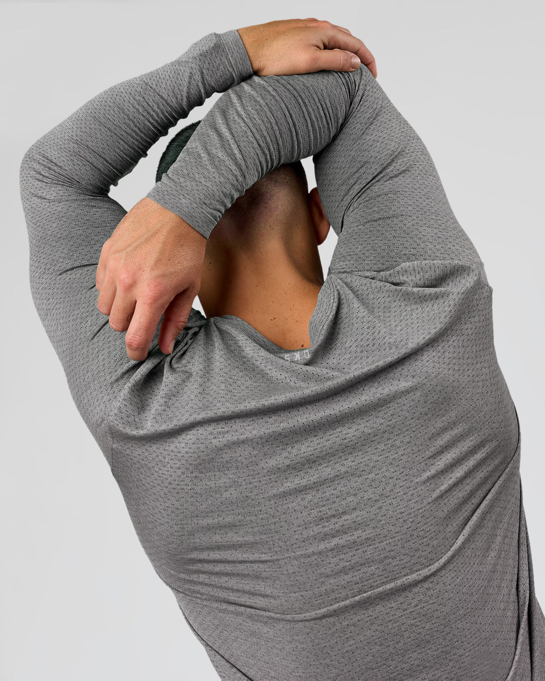 Man wearing AeroFLX+ Seamless Long Sleeve Tee (Set in Sleeve) - Dark Storm/Alloy | Model:Jaiden | Size:L - view 9