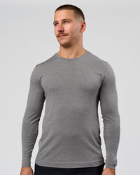 Man wearing AeroFLX+ Seamless Long Sleeve Tee (Set in Sleeve) - Dark Storm/Alloy | Model:Jaiden | Size:L | Thumbnail Index: 12