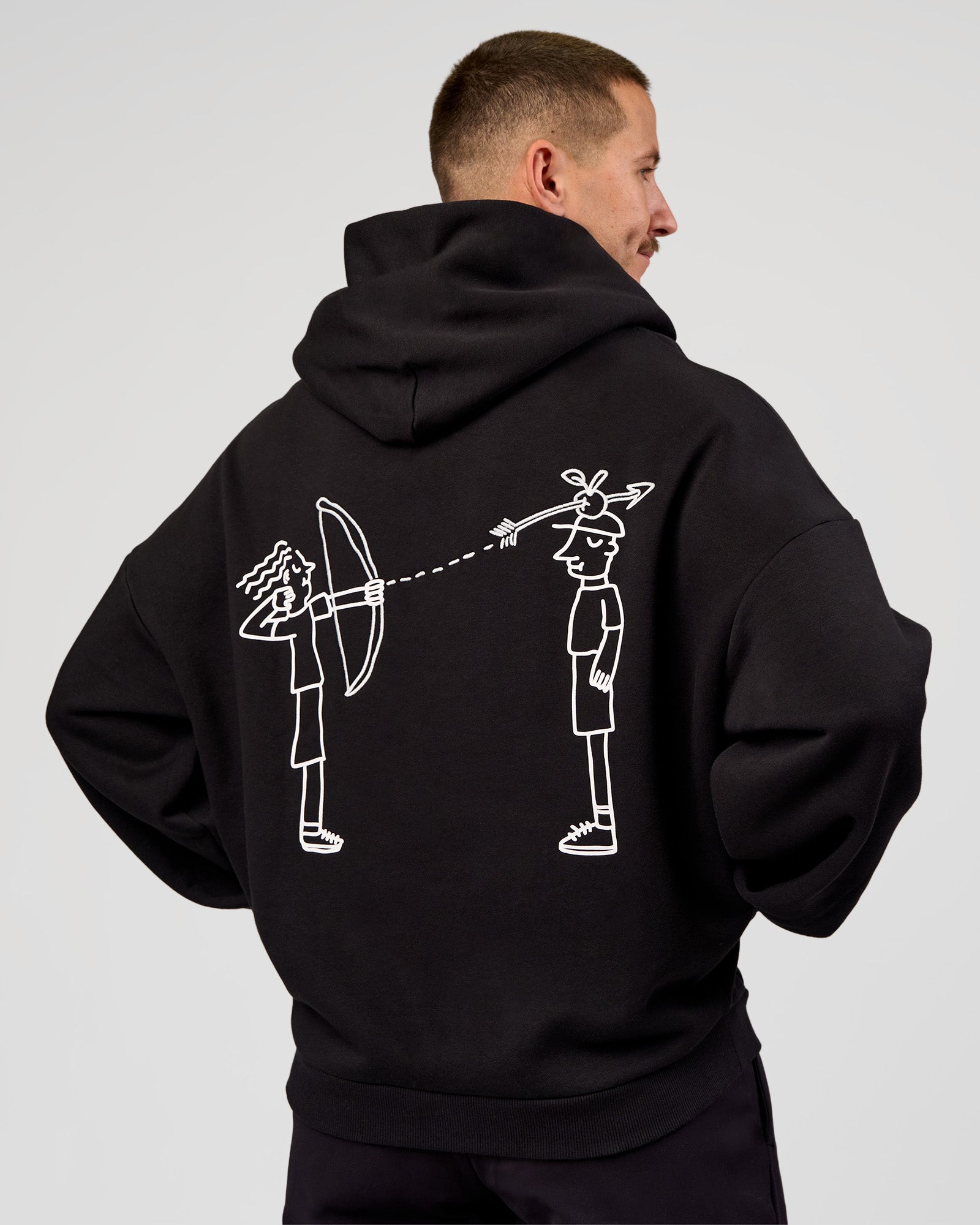 Man wearing Andrew J. Steel x LSKD Boxy Hoodie - Black | Model:Jaiden | Size:L