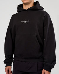Man wearing Andrew J. Steel x LSKD Boxy Hoodie - Black | Model:Jaiden | Size:L | Thumbnail Index: 4