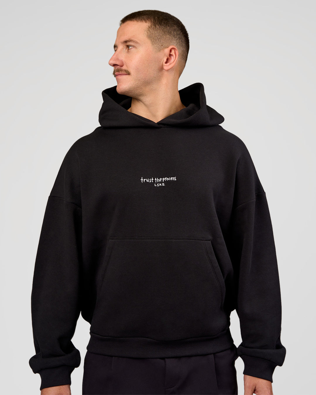 Man wearing Andrew J. Steel x LSKD Boxy Hoodie - Black | Model:Jaiden | Size:L - view 7