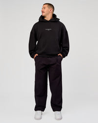Man wearing Andrew J. Steel x LSKD Boxy Hoodie - Black | Model:Jaiden | Size:L | Thumbnail Index: 10