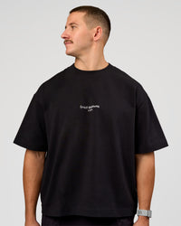 Man wearing Andrew J. Steel x LSKD Heavyweight Boxed Tee - Black | Model:Jaiden | Size:L | Thumbnail Index: 3