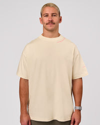 Man wearing Bree Heavyweight Oversized Tee - Vanilla Bean | Model:Jaiden | Size:L | Thumbnail Index: 3