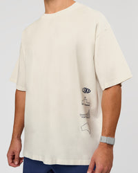 Man wearing Greatest of All Time Heavyweight FLXCotton Oversized Tee - Off White Washed-Scarlet | Model:Jaiden | Size:L | Thumbnail Index: 25