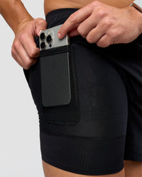 Man wearing Hybrid Lined 5" Short - Black-Reflective | Model:Jaiden | Size:L | Thumbnail Index: 1
