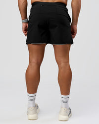 Man wearing Pace 5" Lined Ripstop Short - Black | Model:Jaiden | Size:L | Thumbnail Index: 12