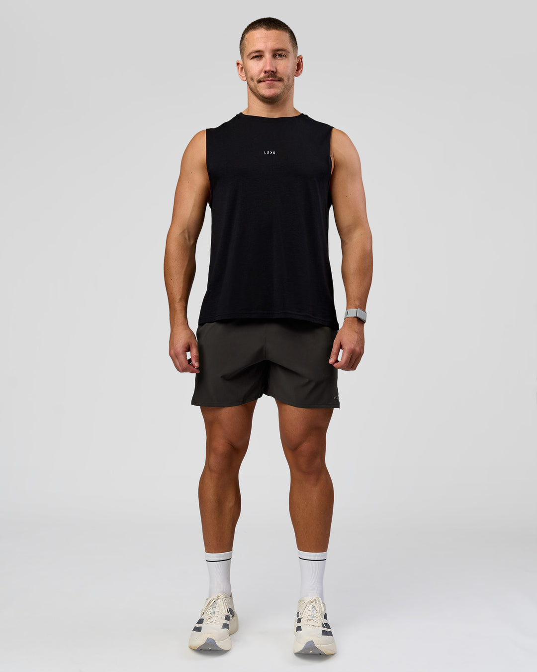 Man wearing Pace 5" Lined Running Short - Black-Onyx | Model:Jaiden | Size:L