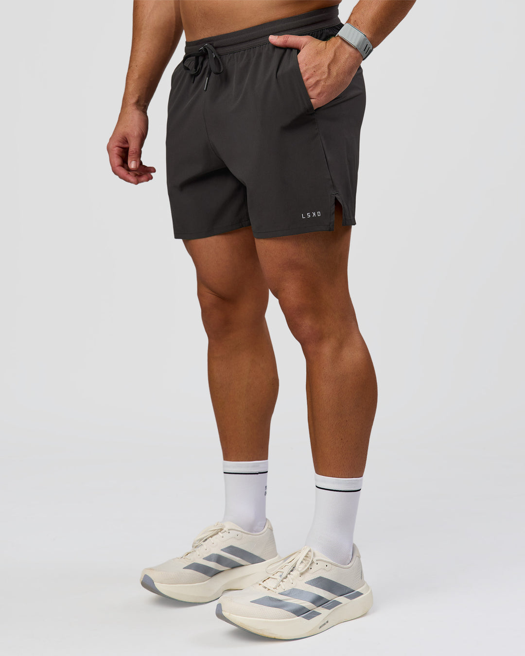 Man wearing Pace 5" Lined Running Short - Black-Onyx | Model:Jaiden | Size:L