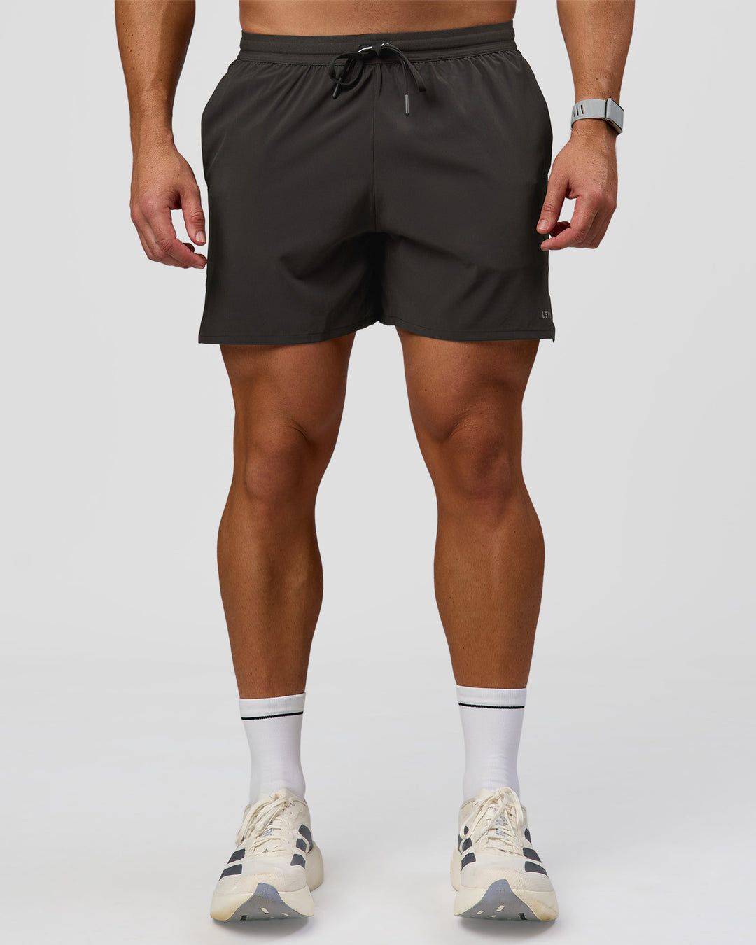 Man wearing Pace 5" Lined Running Short - Black-Onyx | Model:Jaiden | Size:L