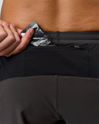 Man wearing Pace 5" Lined Running Short - Black-Onyx | Model:Jaiden | Size:L