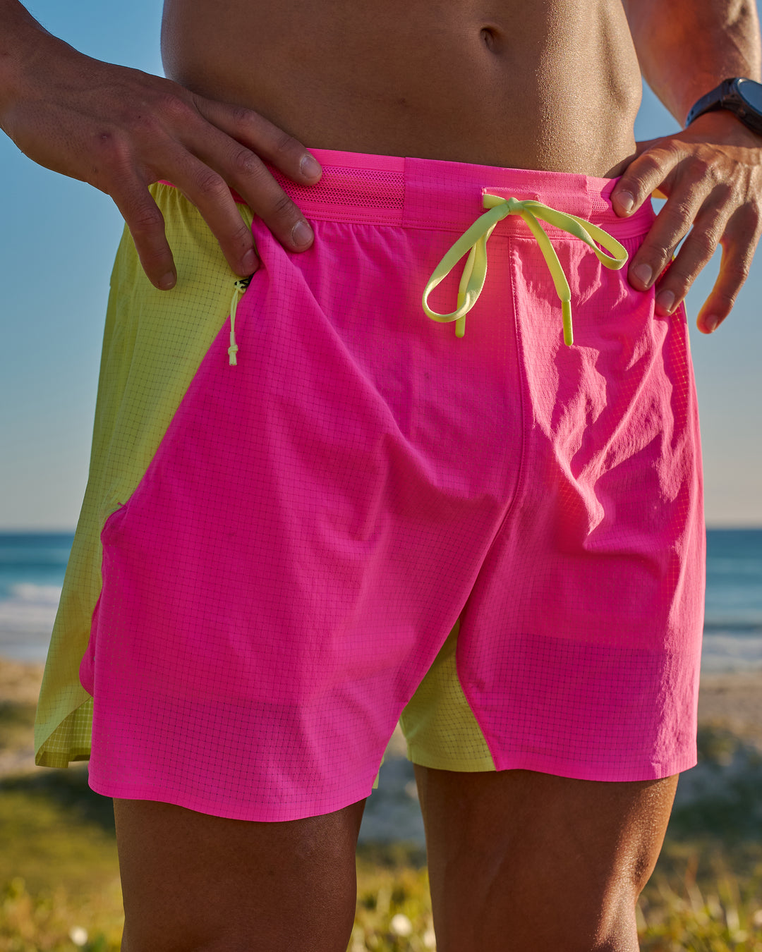 Man wearing UltraAir 5" Lined Performance Short - Sugar Plum-Lime Glo | Model:Jaiden | Size:L - view 12