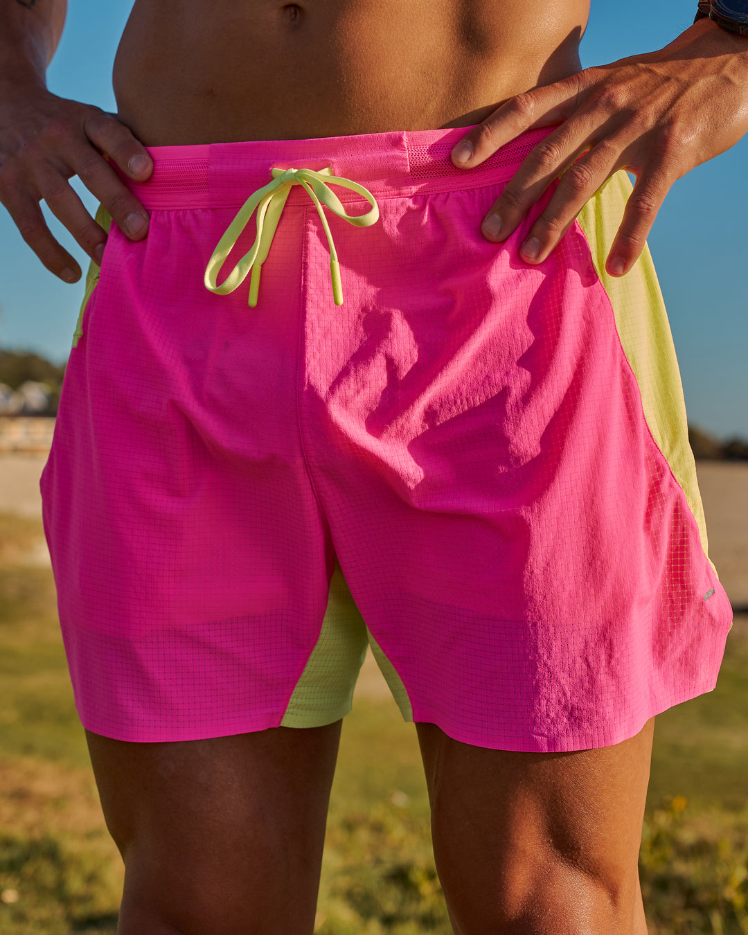 Man wearing UltraAir 5" Lined Performance Short - Sugar Plum-Lime Glo | Model:Jaiden | Size:L - view 15