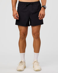 Man wearing Rep 5'' Training Short  - Black | Model:Liam | Size:L