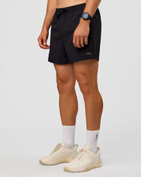 Man wearing Rep 5'' Training Short  - Black | Model:Liam | Size:L
