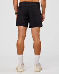Man wearing Rep 5'' Training Short  - Black | Model:Liam | Size:L