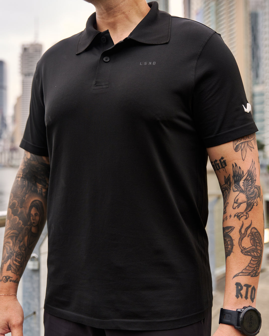 Man wearing Movember x LSKD Drive Seamless Polo - Black | Model:Macca | Size:L - view 4