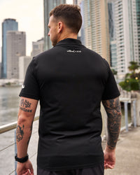 Man wearing Movember x LSKD Drive Seamless Polo - Black | Model:Macca | Size:L | Thumbnail Index: 4