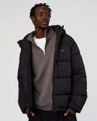 Man wearing Base Puffer Jacket - Black | Model:Okello | Size:L | Thumbnail Index: 1