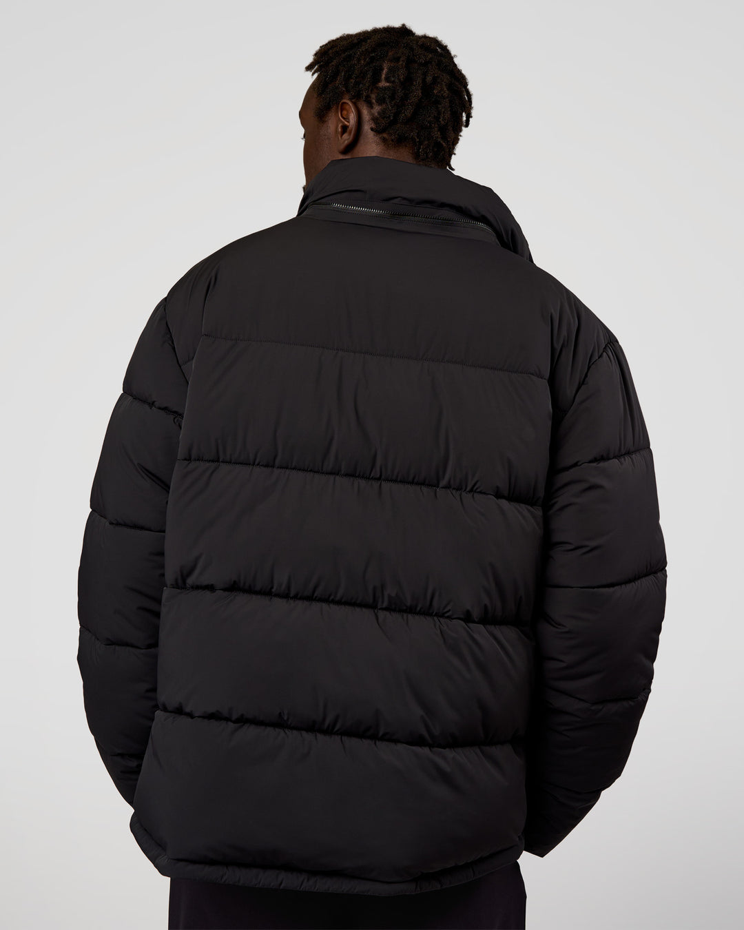 Man wearing Base Puffer Jacket - Black | Model:Okello | Size:L - view 3