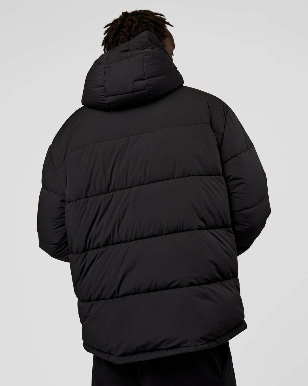 Man wearing Base Puffer Jacket - Black | Model:Okello | Size:L - view 5