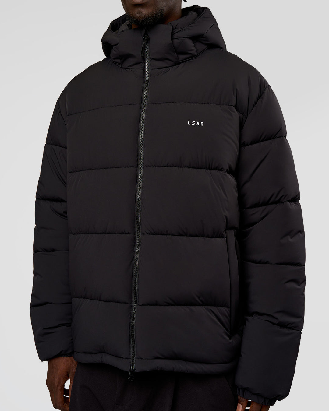 Man wearing Base Puffer Jacket - Black | Model:Okello | Size:L - view 6