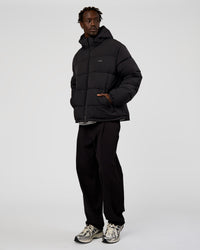 Man wearing Base Puffer Jacket - Black | Model:Okello | Size:L | Thumbnail Index: 8