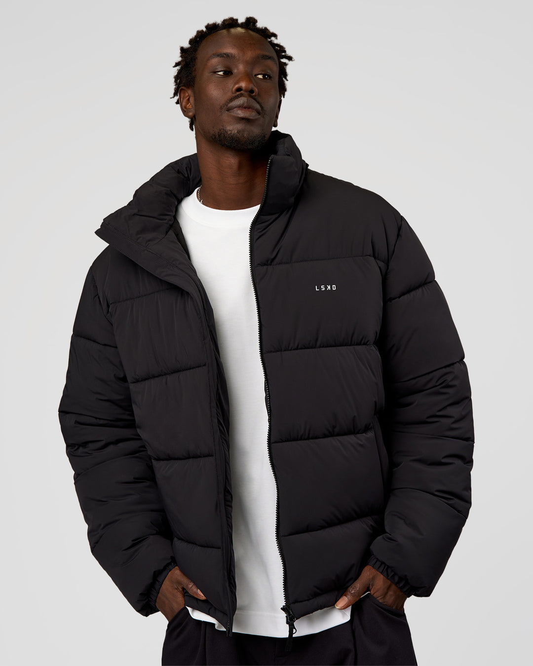 Man wearing Base Puffer Jacket - Black | Model:Okello | Size:L - view 10