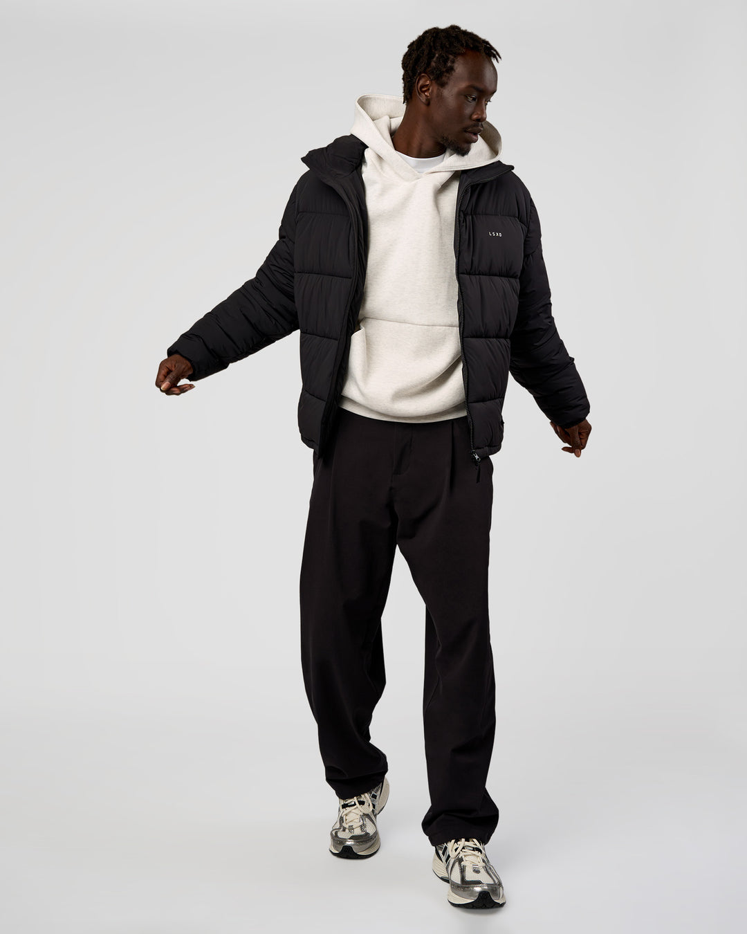 Man wearing Base Puffer Jacket - Black | Model:Okello | Size:L - view 13