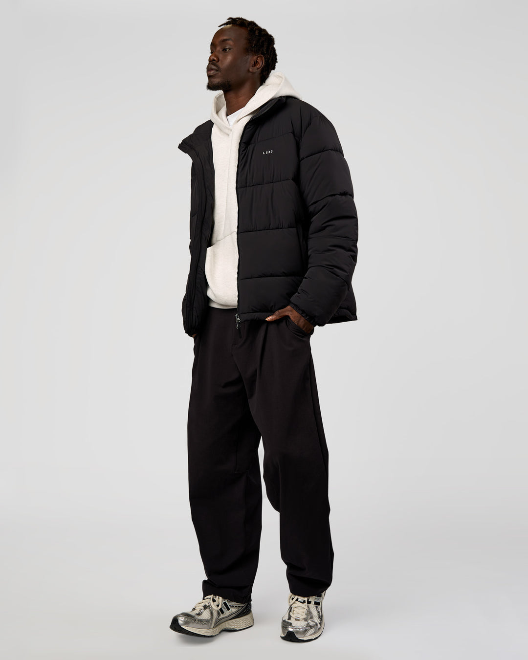 Man wearing Base Puffer Jacket - Black | Model:Okello | Size:L - view 14