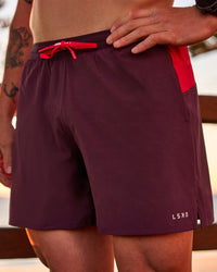 Man wearing Pace 5" Lined Running Short - Cherry Lacquer-Scarlet | Model:Riley | Size:L | Thumbnail Index: 0