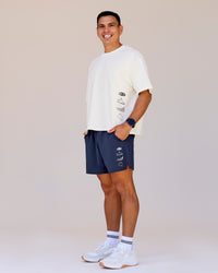 Man wearing Greatest of All Time Functional Training 7" Short - Future Navy-White | Model:Shane | Size:L | Thumbnail Index: 4