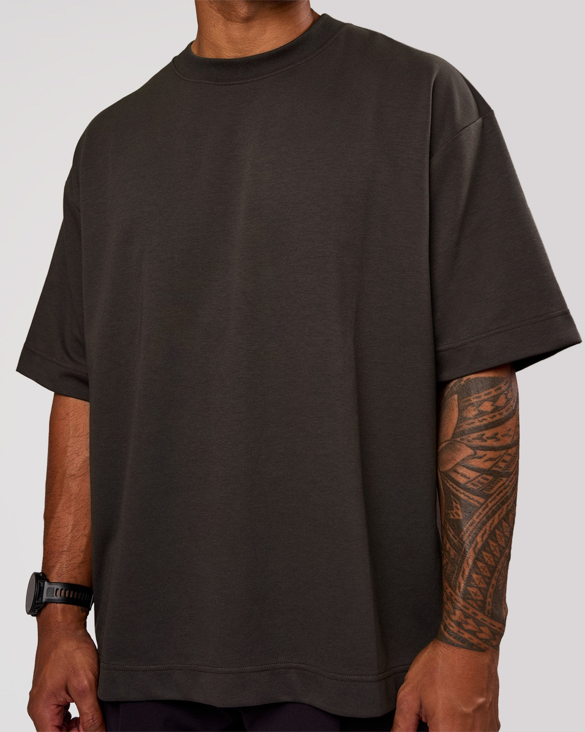 Man wearing AfterDark ZeroCrease Oversized Tee - Onyx | Model:Xav | Size:L