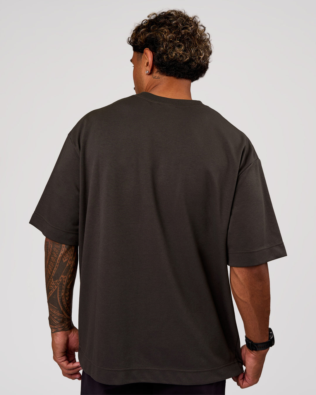 Man wearing AfterDark ZeroCrease Oversized Tee - Onyx | Model:Xav | Size:L - view 4