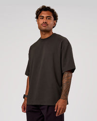 Man wearing AfterDark ZeroCrease Oversized Tee - Onyx | Model:Xav | Size:L | Thumbnail Index: 0