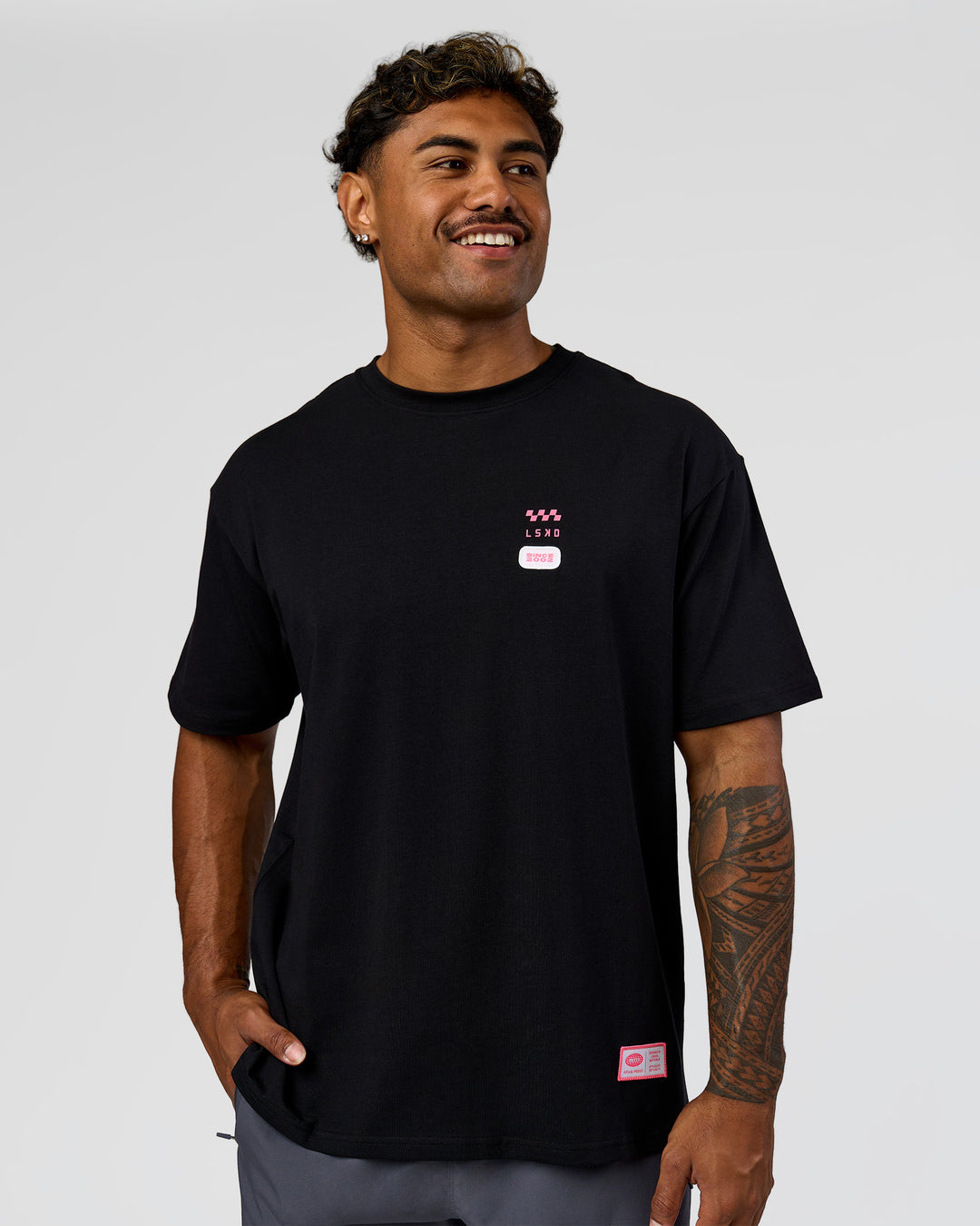 Man wearing Archive FLXCotton Oversized Tee - Black-Candy Pink | Model:Xav | Size:L - view 5