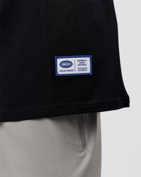 Man wearing Archive FLXCotton Oversized Tee - Black-Electric Indigo | Model:Xav | Size:L | Thumbnail Index: 11