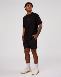 Man wearing Base FLXCotton Tee Oversized - Black | Model:Xav | Size:L | Thumbnail Index: 4