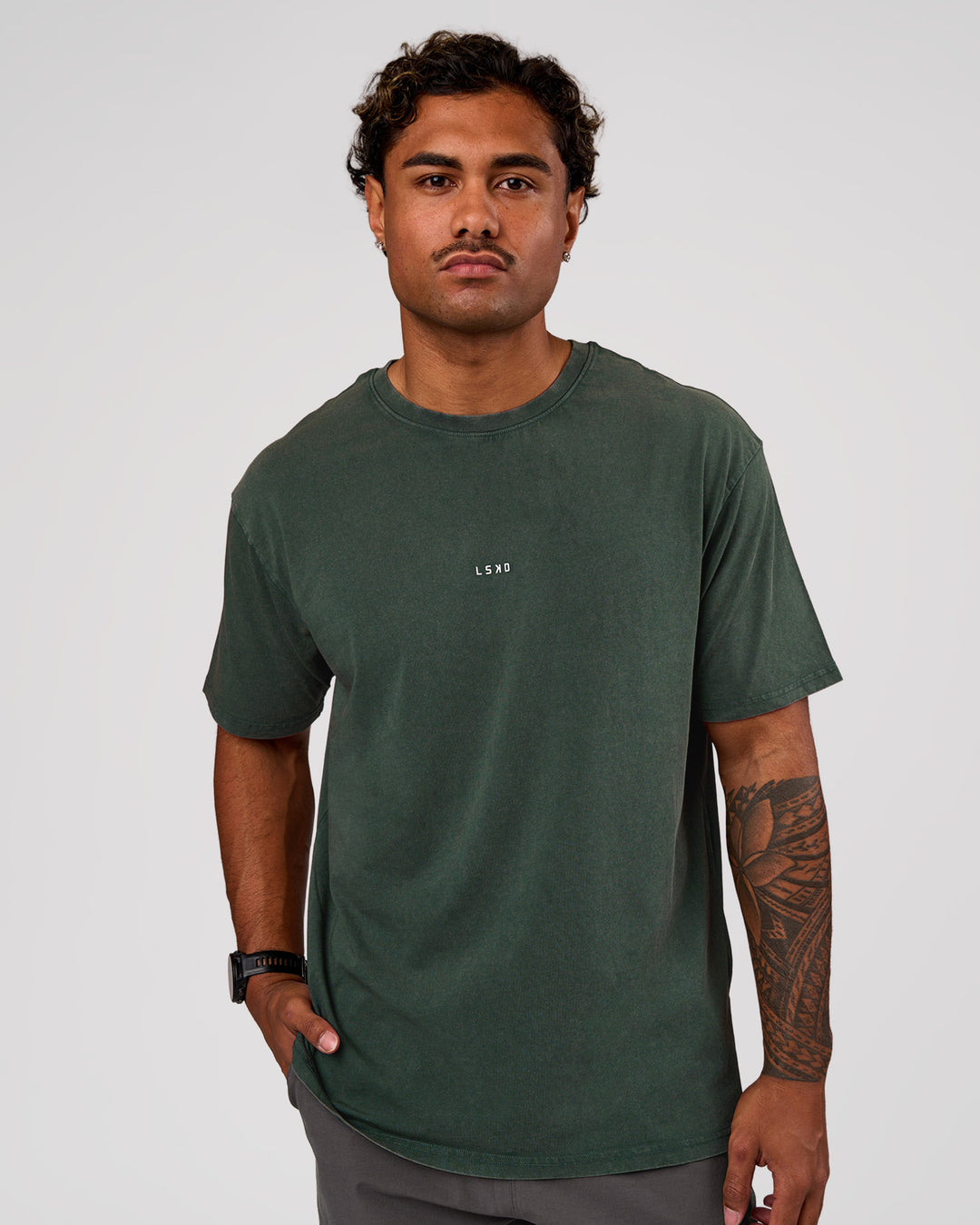 Man wearing Base FLXCotton Tee Oversized - Midnight Green Washed | Model:Xav | Size:L - view 1