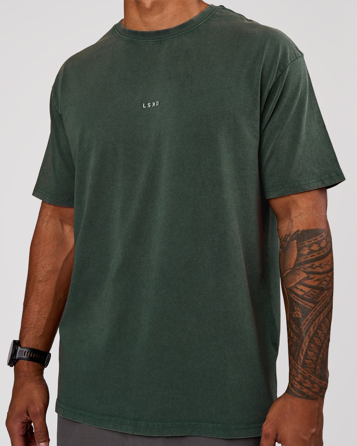Man wearing Base FLXCotton Tee Oversized - Midnight Green Washed | Model:Xav | Size:L