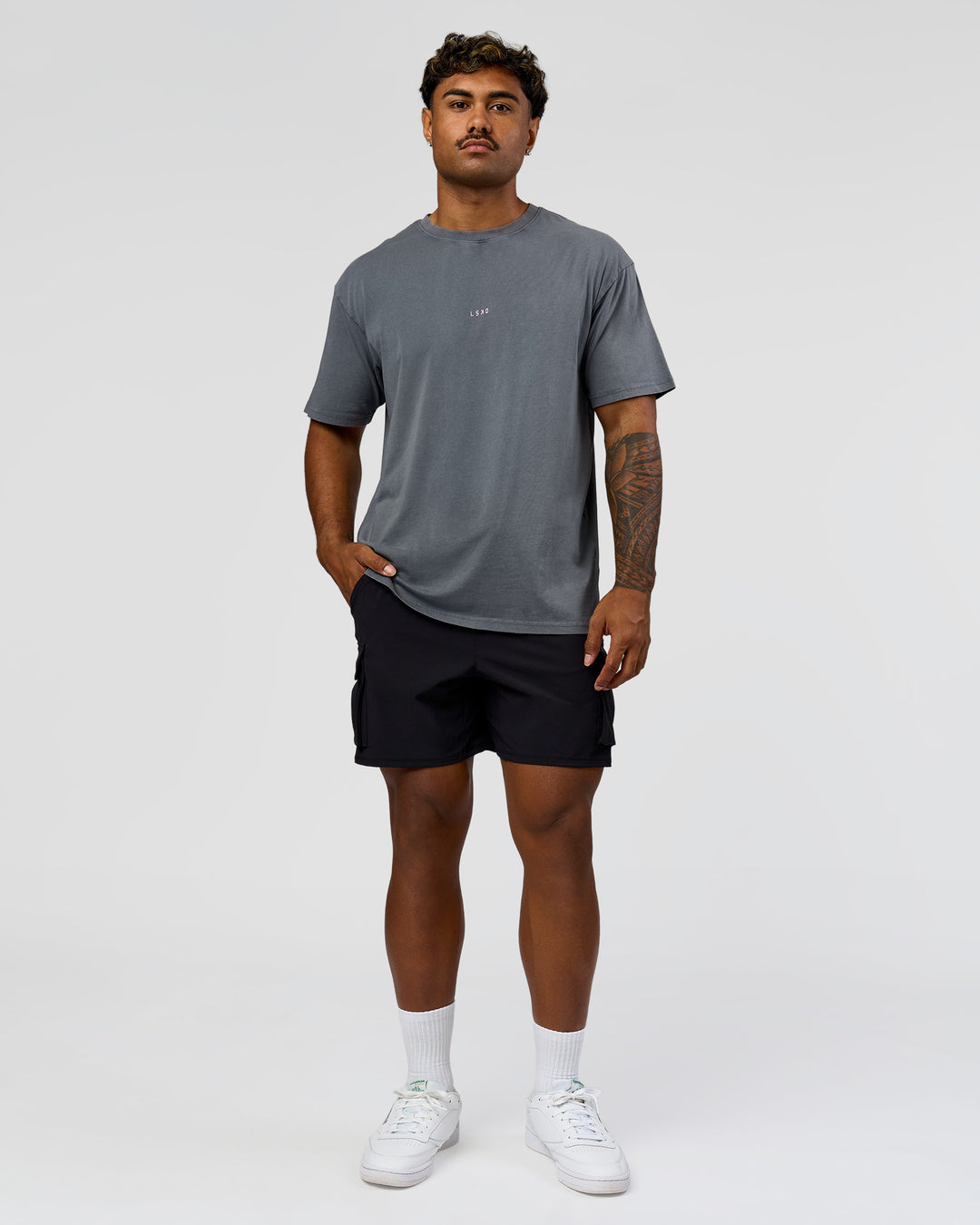 Man wearing Built On Values FLXCotton Oversized Tee - Dark Storm Washed-Pink Rose | Model:Xav | Size:L - view 5