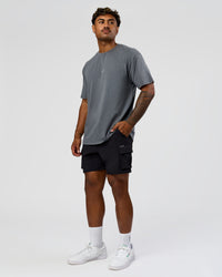 Man wearing Built On Values FLXCotton Oversized Tee - Dark Storm Washed-Pink Rose | Model:Xav | Size:L | Thumbnail Index: 6