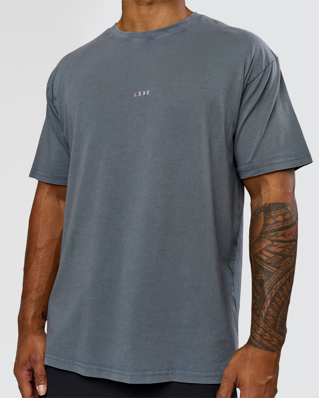 Man wearing Built On Values FLXCotton Oversized Tee - Dark Storm Washed-Pink Rose | Model:Xav | Size:L - view 11