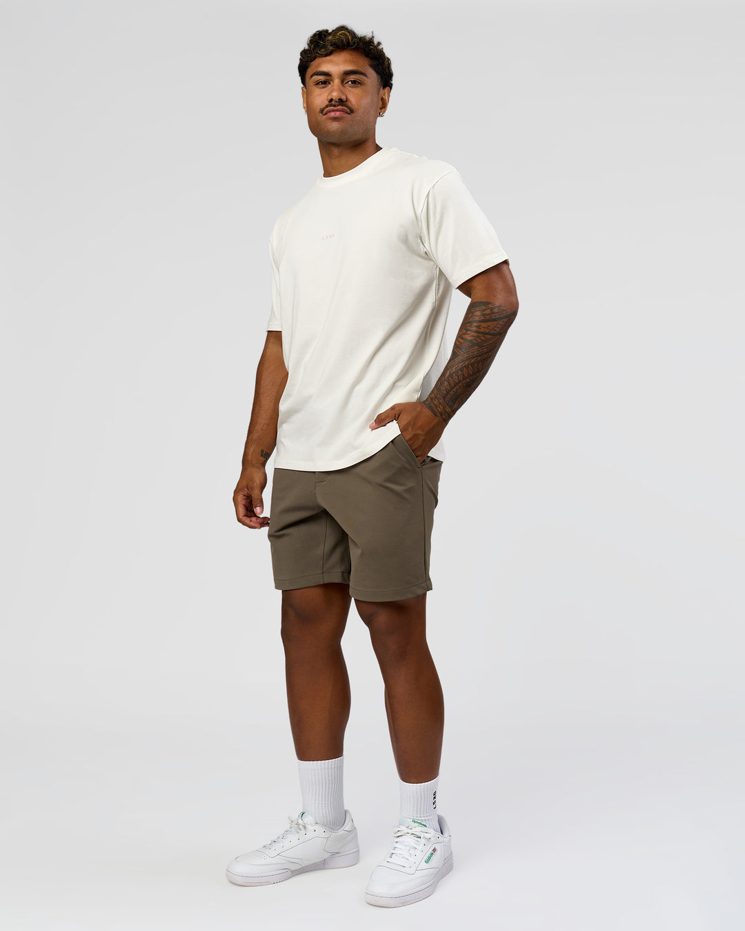 Man wearing Built On Values FLXCotton Oversized Tee - Off White-Pink Rose | Model:Xav | Size:L - view 6