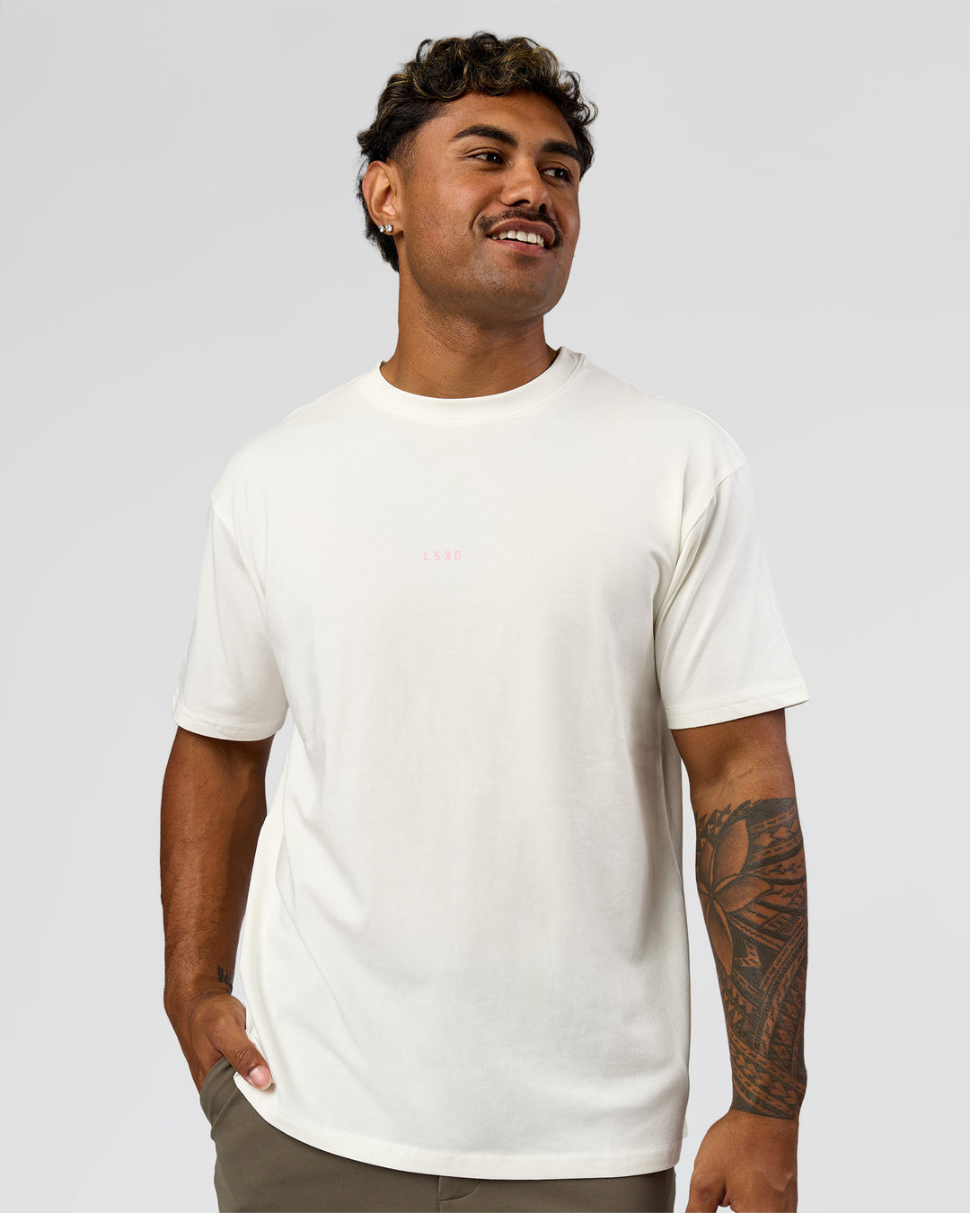 Man wearing Built On Values FLXCotton Oversized Tee - Off White-Pink Rose | Model:Xav | Size:L - view 9