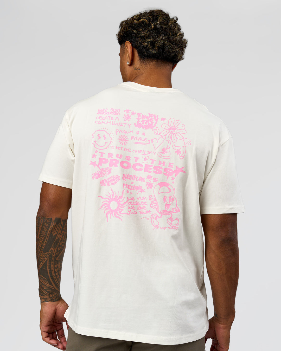 Man wearing Built On Values FLXCotton Oversized Tee - Off White-Pink Rose | Model:Xav | Size:L - view 3