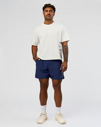 Man wearing Greatest of All Time Functional Training 7" Short - Future Navy-White | Model:Xav | Size:L | Thumbnail Index: 10