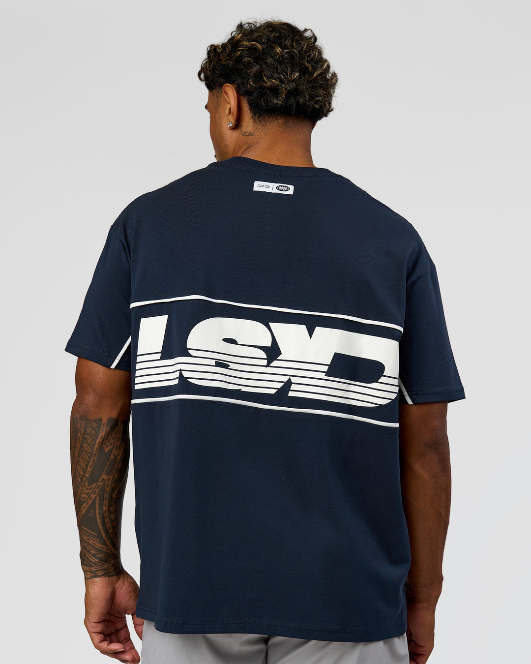 Man wearing Inline Heavyweight FLXCotton Oversized Tee - Midnight Navy-White | Model:Xav | Size:L - view 2
